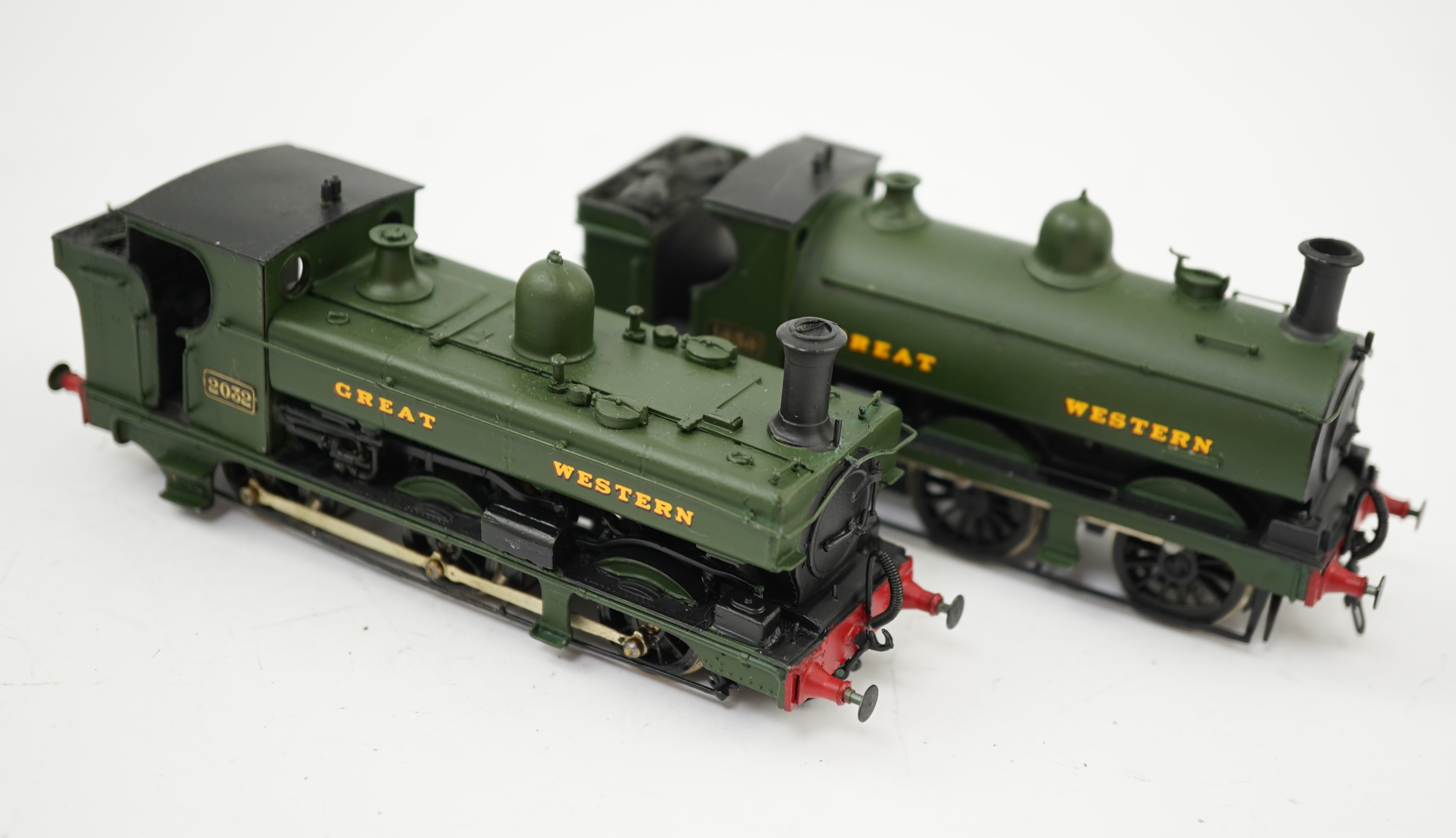 Two 00 gauge brass and white metal kit built GWR tank locomotives; a 2021 class 0-6-0PT, 2032, together with an 1854 class 0-6-0ST, 1858, constructed, painted and lined to a high standard, both motored for two rail opera